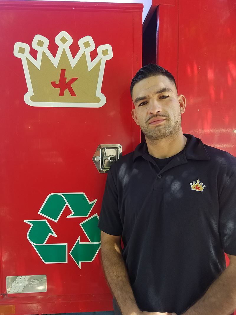Junk King Franchise Owner,Carlos and Vanessa Duenas.
